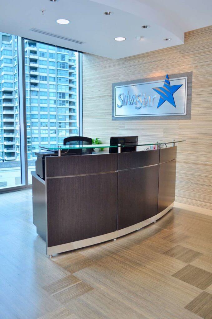 Custom reception desk in a modern corporate office in Vancouver.