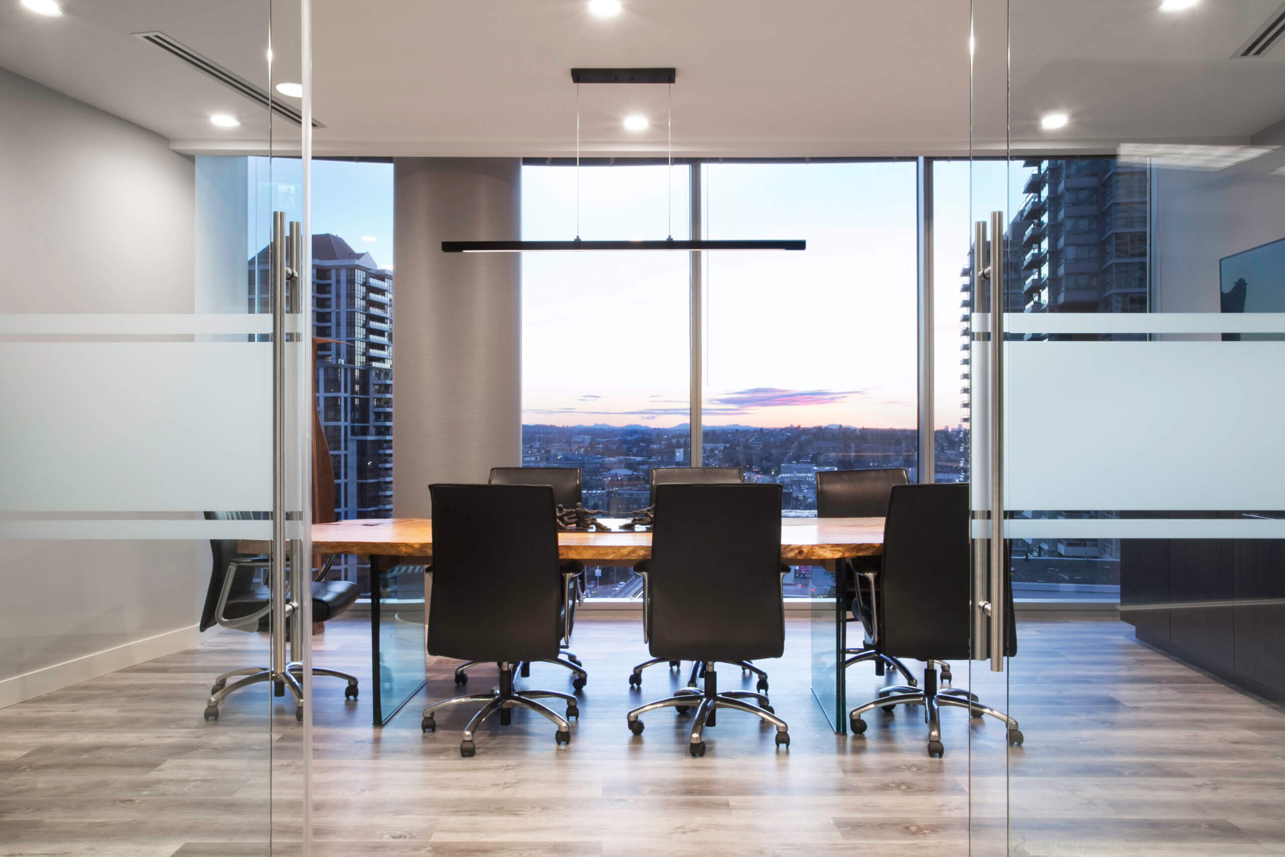 Modern office boardroom with life edge table and chairs.